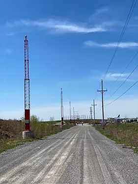 a road with power lines on the side