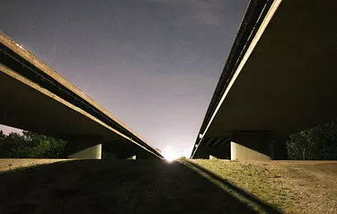 a bridge with a sunset