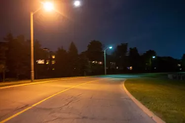 a street with street lights and trees