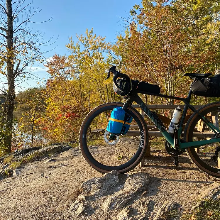 Canyon Grizl parked on a dirt path by the lake