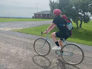 Kerianne riding her classic Peugeot bike