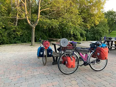 a group of bicycles parked on a brick path