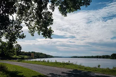 a road next to a body of water