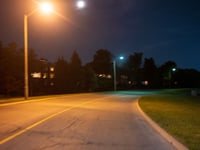 a street with street lights and trees