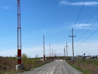a road with power lines on the side