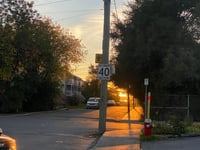 a street sign on a sidewalk