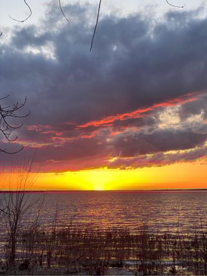 a sunset over a body of water