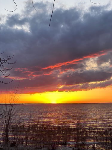 a sunset over a body of water