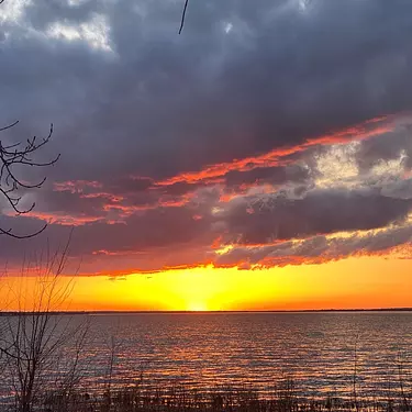 a sunset over a body of water
