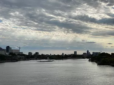 a body of water with a city in the background