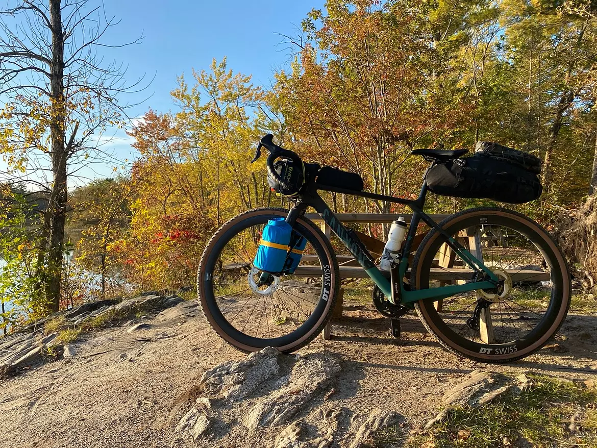 Canyon Grizl parked on a dirt path by the lake