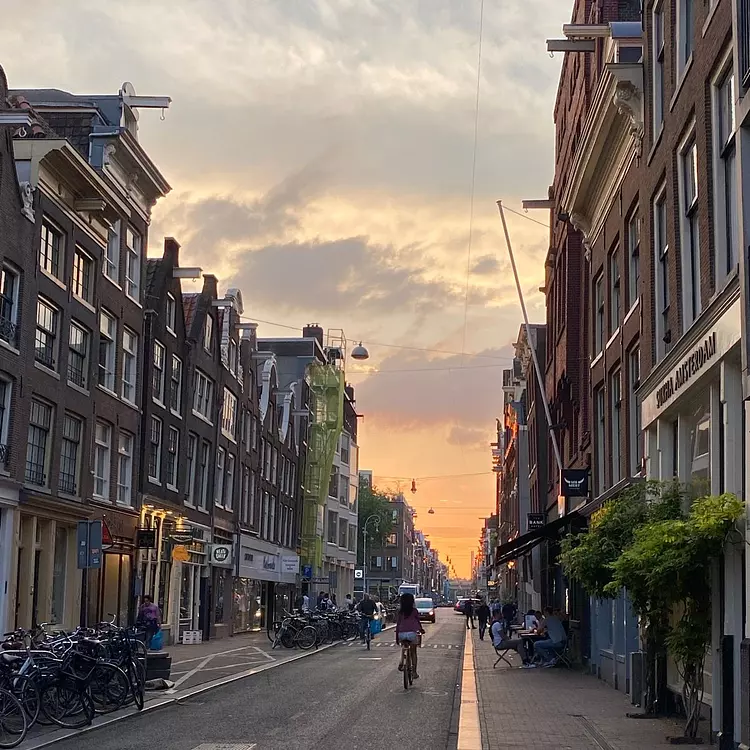 a person riding a bicycle on a city street