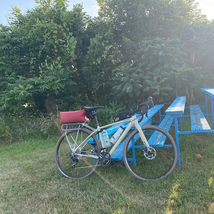 a bicycle parked on a fence