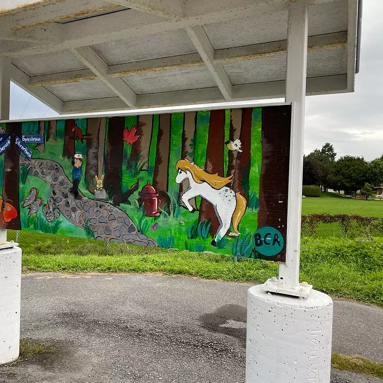 a sign with a picture of a horse and a dog on it