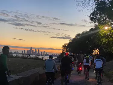 a group of people riding bikes