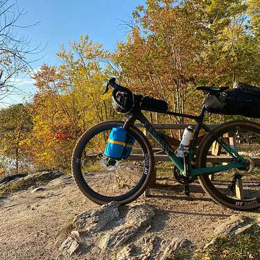 Canyon Grizl parked on a dirt path by the lake