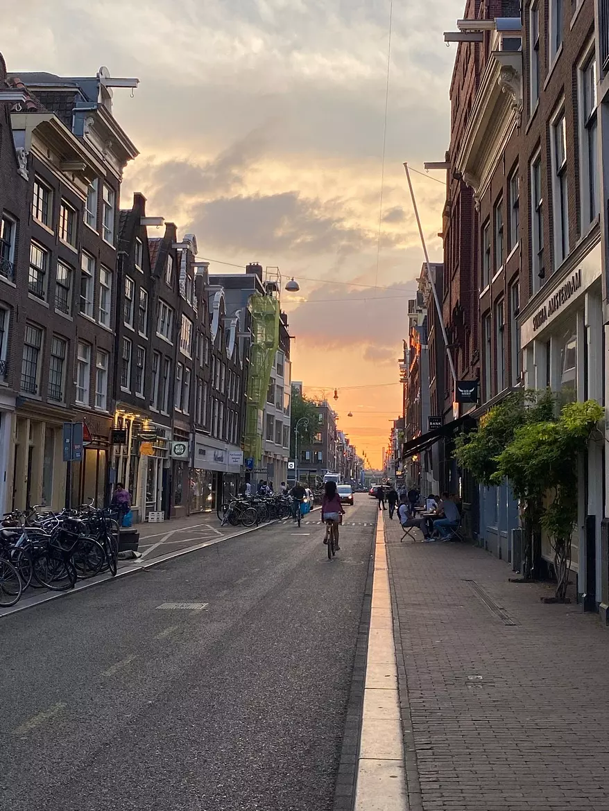 a person riding a bicycle on a city street