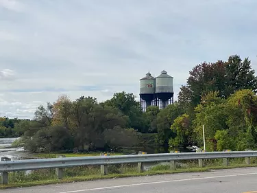 a building with a tower surrounded by trees