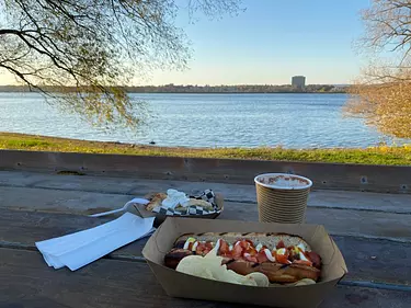 eating a hotdog with a lovely fall view