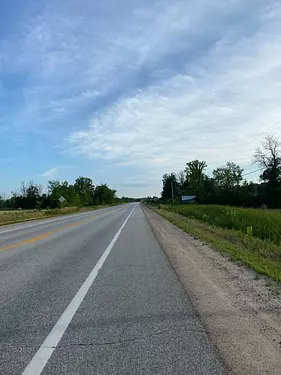 a road with grass on the side