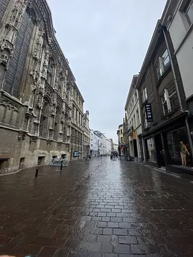 a brick road between buildings